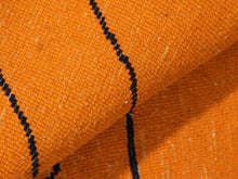 Load image into Gallery viewer, Orange wool rug featuring linear black artwork


