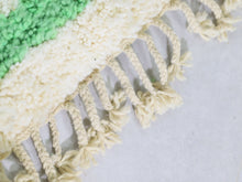 Load image into Gallery viewer, Flatlay of vintage-style green shag rug from Morocco



