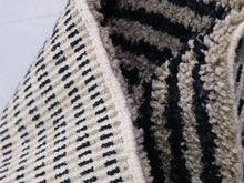 Load image into Gallery viewer, Black and white Moroccan wool rug with artisan craftsmanship


