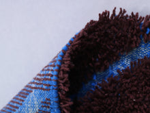Load image into Gallery viewer, Burgundy Moroccan rug with hand-knotted wool and blue patterns


