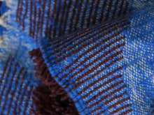 Load image into Gallery viewer, Bold handmade Moroccan rug with chevron blue accents on red base


