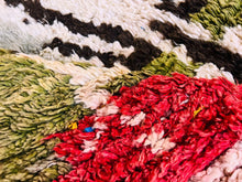 Load image into Gallery viewer, Close-up of a handmade Berber rug showcasing intricate patterns and vibrant colors, perfect as a unique Moroccan aesthetic addition to any room.&quot;
