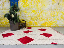 Load image into Gallery viewer, Authentic red and white Moroccan Beni Ourain rug spread on the floor,
