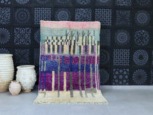 Load image into Gallery viewer, Artistic Moroccan wool rug with an abstract purple and blue design.
