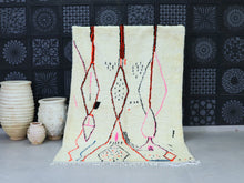 Load image into Gallery viewer, Handwoven Moroccan wool rug with minimalist white background and colorful abstract lines.
