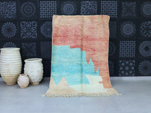 Load image into Gallery viewer, Handmade Moroccan wool rug with an abstract coral and turquoise pattern.
