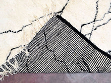 Load image into Gallery viewer, Sophisticated Moroccan wool rug, handcrafted with natural fibers, showcased in a contemporary setting
